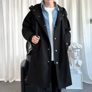 Men's black hooded long trench coat, Korean style casual outerwear for autumn and winter daily wear.