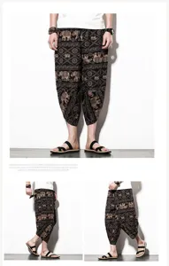 Ethnic elephant print men cropped pants detail, loose casual harem pants close-up view.