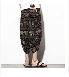Detailed view of men's ethnic elephant print cropped harem pants, comfortable linen fabric.