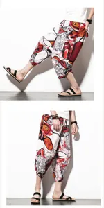 Detail shot of men ethnic floral linen cropped pants showing loose fit and stylish print.