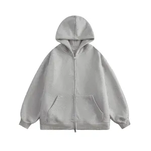 Grey zip-up hoodie detail view highlighting full metal zipper, hood, and kangaroo pockets.