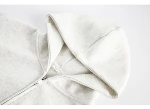 Detail view of mens light grey heather zip up hoodie sweatshirt hood collar and metal zipper.