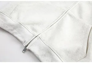 Men vintage style zip-up hoodie clothing detail close up showing zipper pocket grey fabric texture