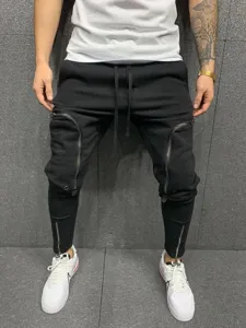 Ανδρικό slim fit παντελόνι φόρμας με τσέπες φερμουάρ και μανσέτα για γυμναστήριο.