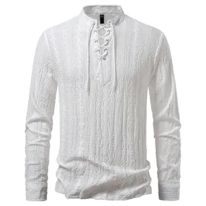 Detailed view of white men long sleeve shirt lace up V neck jacquard fabric texture
