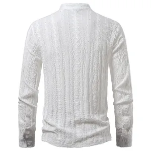 Detail view of men's white long sleeve jacquard shirt fabric texture and back construction.