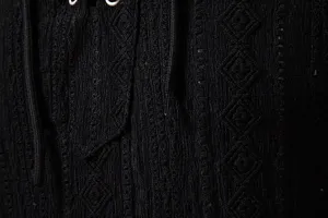Men black long sleeve jacquard shirt detail view with lace-up V-neck and textured fabric.
