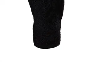 Black jacquard long sleeve shirt cuff detail, premium breathable men's shirt fabric close up.