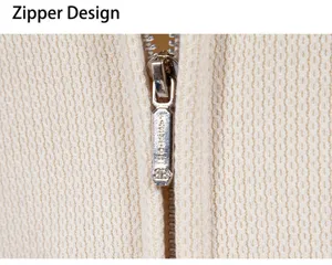 Close-up detail of mens knit cardigan zipper design, fine textured fabric, premium hardware.