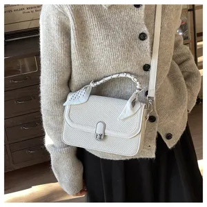 Minimalist women's white crossbody shoulder bag featuring a stylish scarf wrapped handle detail.