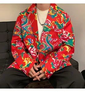 Detail view of men floral print suit jacket, vibrant red fabric, classic lapel design.