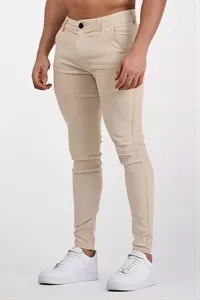 Men's casual slim trousers in khaki stretch fabric, close-up view showing fit and details.