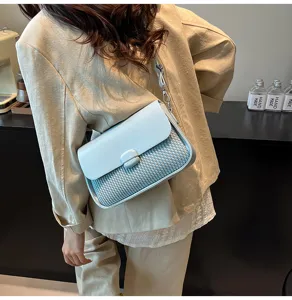 Chic underarm shoulder bag with woven texture detail, elegant fashion small square bag for daily commute.