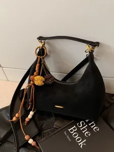 Fashion black suede hobo shoulder bag for women, chic commuting messenger bag with beaded tassel.