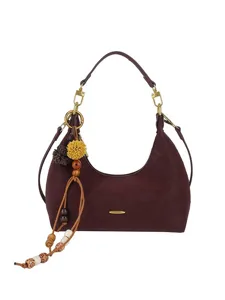 Stylish burgundy suede shoulder bag for women, chic hobo crossbody bag with chic charms.