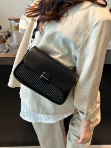 Trendy black leather shoulder bag main image showcasing woven texture underarm design for women