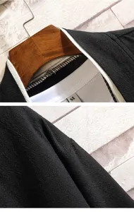 Detail view of Chinese style men's solid color contrast cardigan T-shirt fabric and collar.