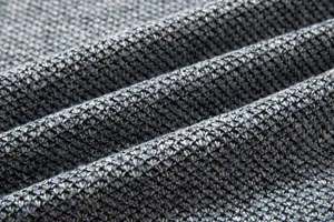 Detailed close-up view of the premium grey and black mixed knit fabric texture and soft drapes.