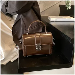 Dark brown glossy structured top-handle handbag, chic vintage box bag for women daily commute.