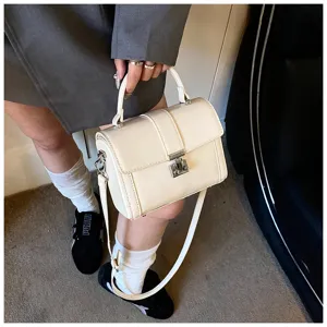 White structured top-handle box bag, versatile commuter shoulder and cross-body bag style.