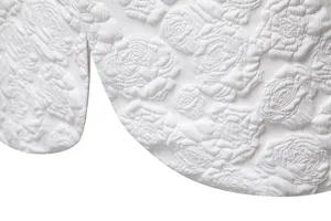 Detailed view of men's business slim fit suit featuring elegant white rose floral jacquard fabric.