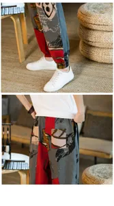 Detail shot of men's casual linen harem trousers with artistic patchwork prints, indoor setting.