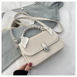 Stylish minimalist beige crossbody shoulder bag with woven texture, metal lock and cute scarf.