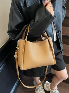 Stylish women's leather bucket bag, large capacity shoulder crossbody tote for autumn daily commute.