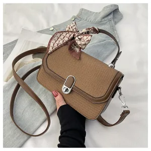 Stylish brown woven crossbody bag with silk scarf accessory, perfect for womens daily casual wear.