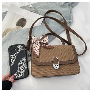 Chic brown textured small square handbag with scarf detail, stylish crossbody bag for women.
