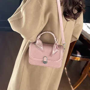 Stylish pink women shoulder handbag with textured flap design and chic scarf handle for daily wear.