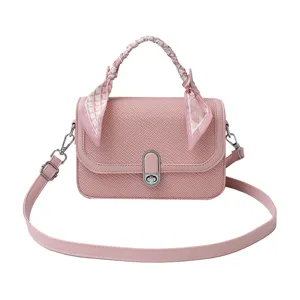 Pink women crossbody bag with scarf handle, chic textured shoulder handbag for daily fashion.