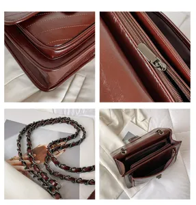 Brown quilted chain shoulder bag detail view showing texture, zipper, strap, and interior.