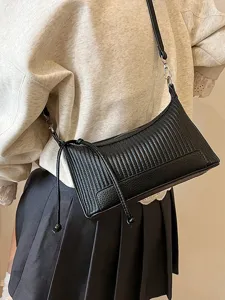 Stylish black pleated shoulder bag for women, trendy chic retro baguette pillow bag daily.