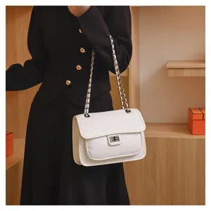 Detailed view of the stylish white quilted chain shoulder bag, elegant design for women.