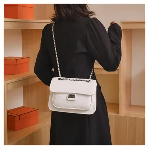 Stylish white quilted chain crossbody bag for women, elegant faux leather flap shoulder bag.