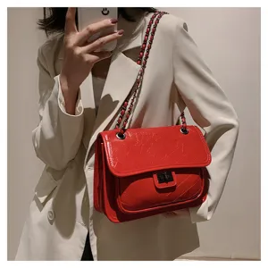 Red quilted chain shoulder bag for women, stylish crossbody bag with turn lock closure.