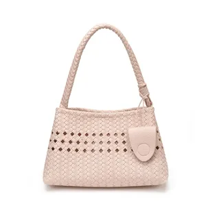Pink woven leather shoulder bag with chic cut-out details, elegant daily commute accessory.