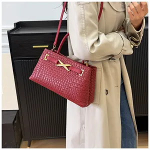 Elegant red woven leather shoulder bag with gold hardware for women autumn commute.