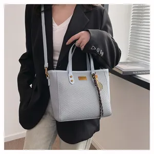 Light blue large capacity tote bag for women, retro casual commuter shoulder handbag for spring.