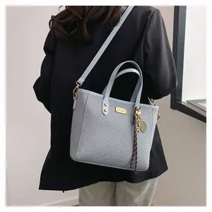 Trendy large capacity commuting tote bag, stylish spring and summer handbag for daily use.