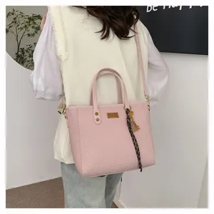 Stylish pink woven tote bag for women, large capacity shoulder bag for daily commute.