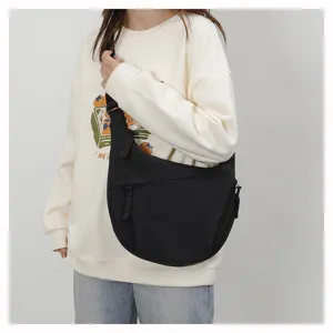Casual black crossbody crescent bag for women, versatile daily shoulder bag with large capacity.