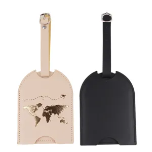 Set of two leather luggage tags featuring a stylish gold world map design and a pull-out card slot.