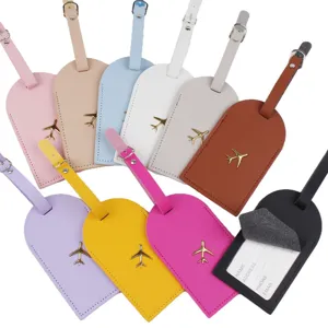 Etichette per bagagli in pelle PU colorata con stemma aereo dorato e tasca per carte.