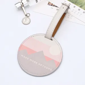 Etiqueta de equipaje redonda de cuero PU con elegante impresión, accesorio de viaje.