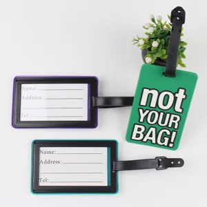 PVC luggage tag detail view showing cute green text design and ID card insert slots clearly.