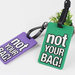 PVC soft rubber luggage bag tag with funny text detail showing green and purple options clearly.