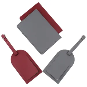 PU leather passport holder and matching luggage tag set in grey and red for travel.