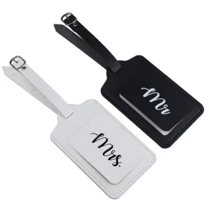 Close-up detail of black and white couple PU leather luggage tags with mr and mrs text.